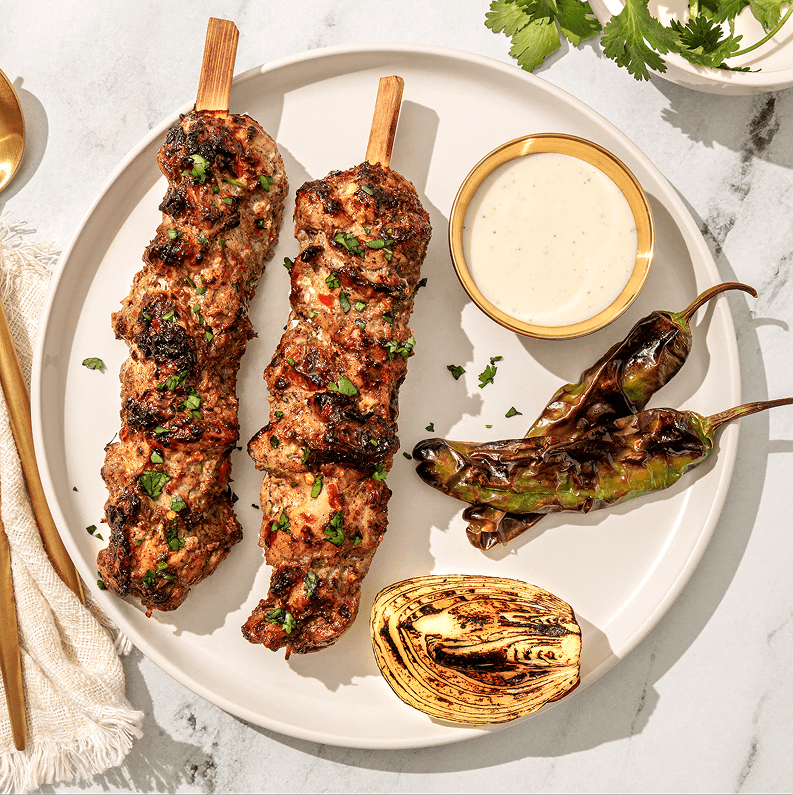 Flame-grilled chicken skewers